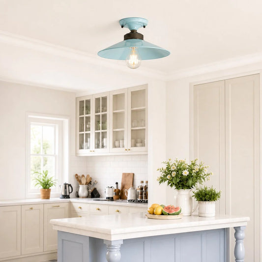 Kitchen with a light blue ceiling light fixture, white cabinets, and a marble countertop.