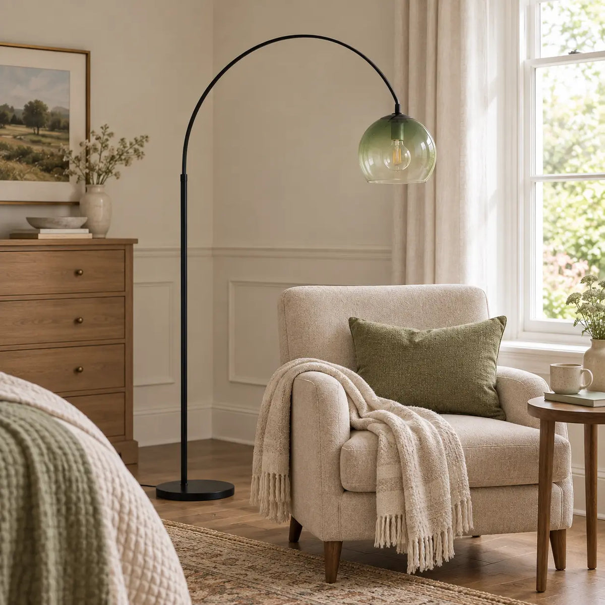 Black arched floor lamp with green globe in a bedroom lounge area