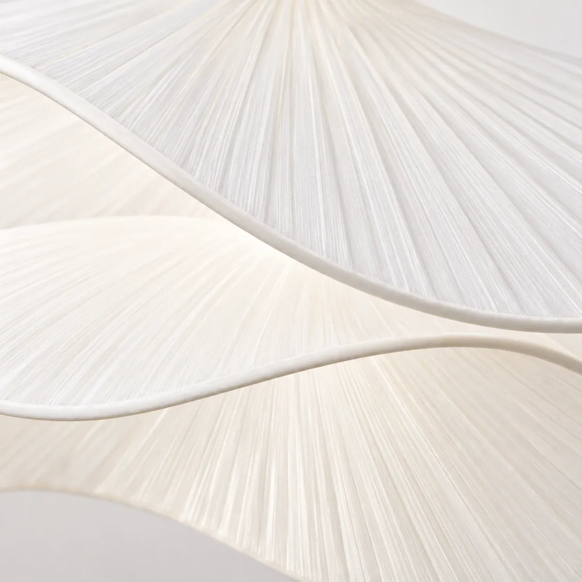 Close view of the layered waved translucent white shade