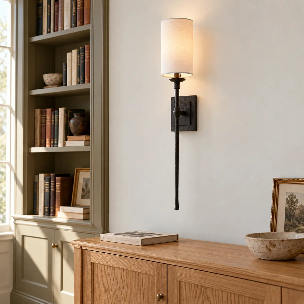 Fabric shade wall light in a home library