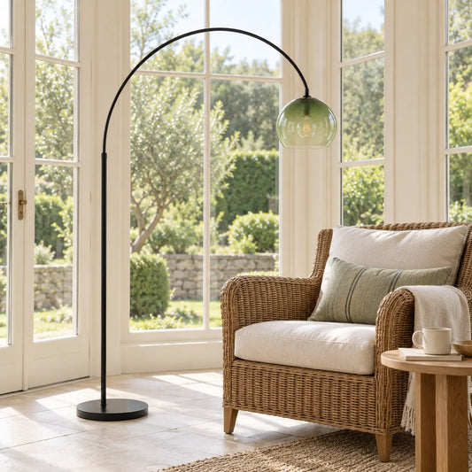 Black metal and green glass floor lamp in a bright sunroom