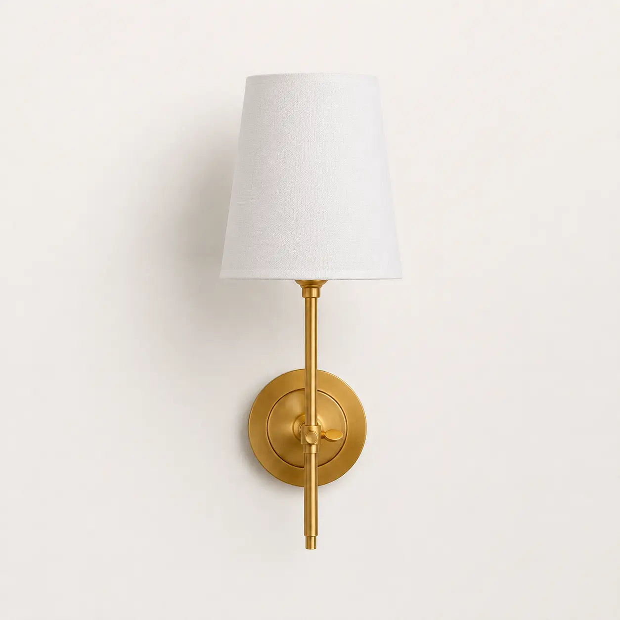 Brass tapered linen shade wall light studio view