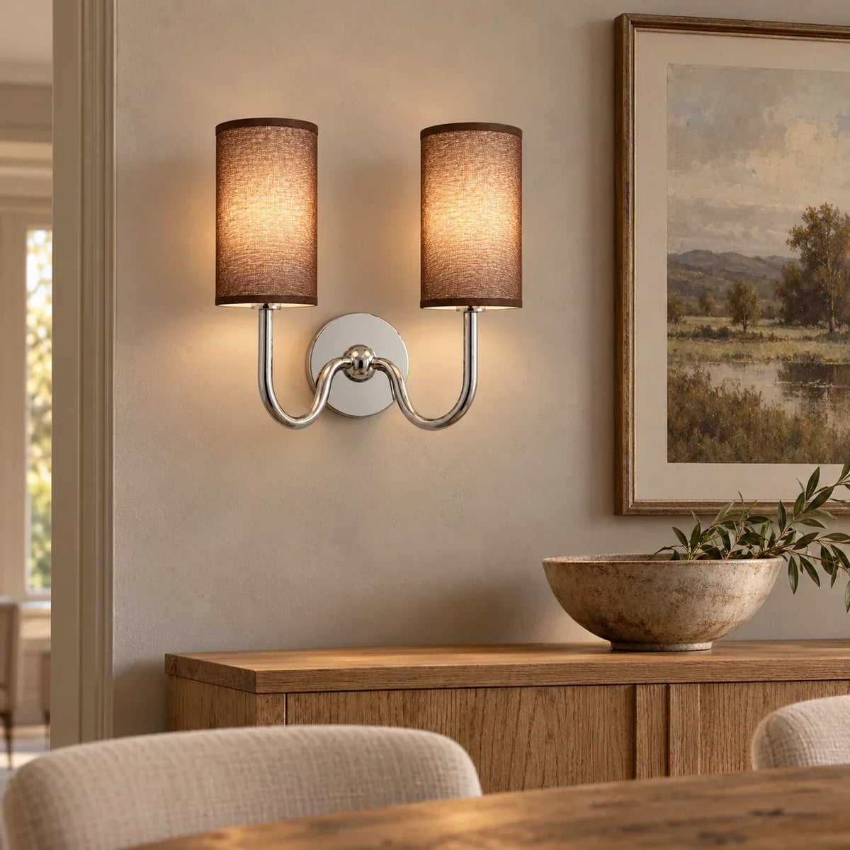 Chrome double wall light with coffee linen shade in a British interior