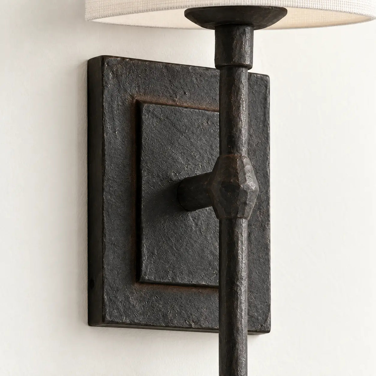 Textured black rectangular wall backplate and central rod detail