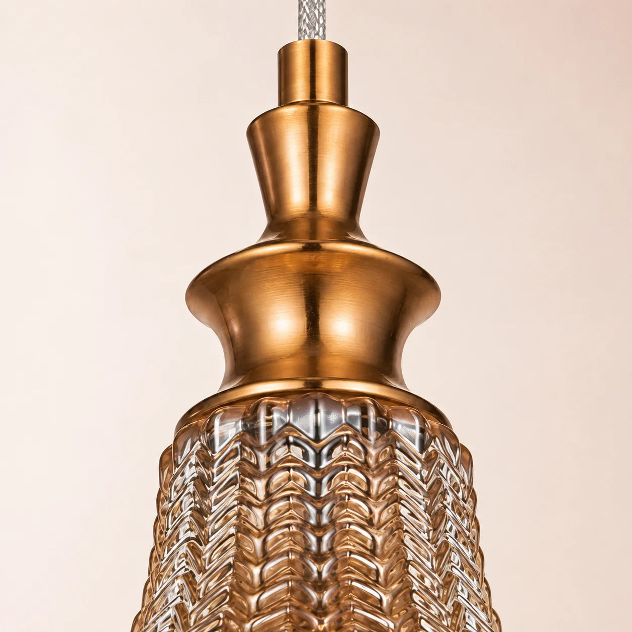 Close-up of the antique brass neck and clear chevron glass