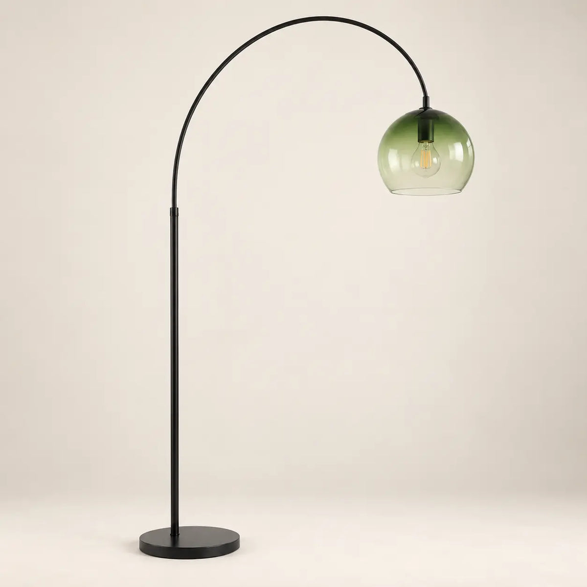 Modern arched green glass globe floor lamp on a warm white background
