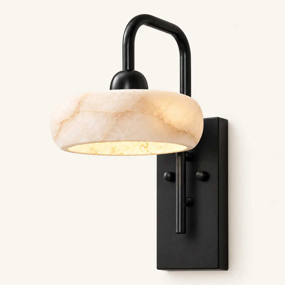 Rounded alabaster cylinder wall light with matte black metal base