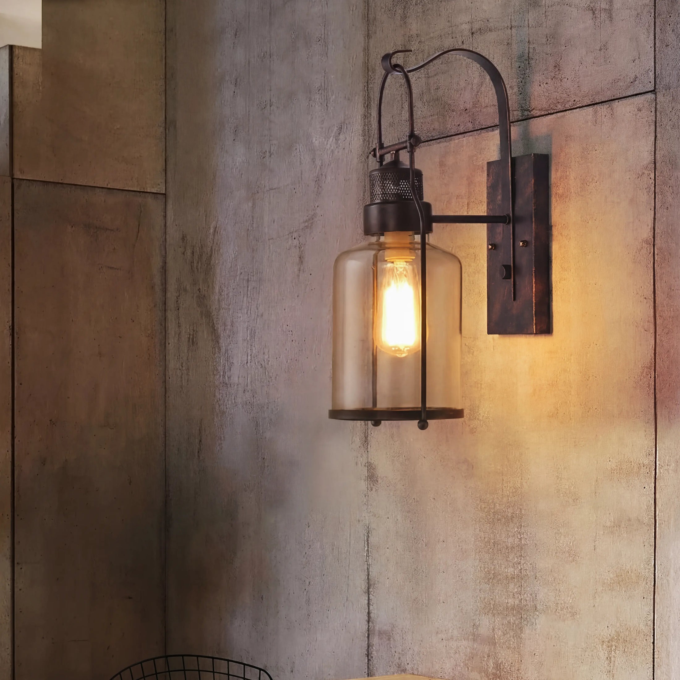 Vintage industrial metal wall light with a glass shade