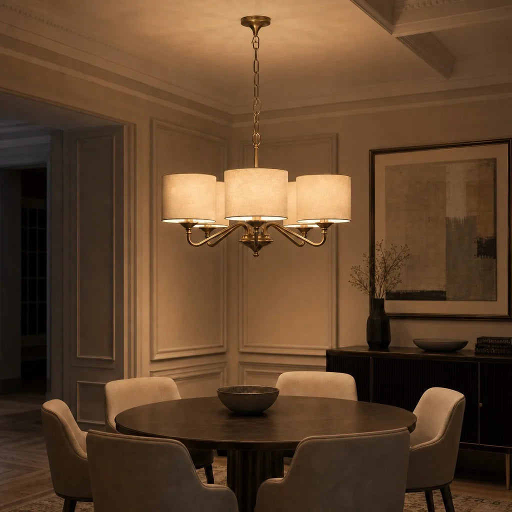 Dining room with a chandelier, table, and chairs in a dimly lit room.