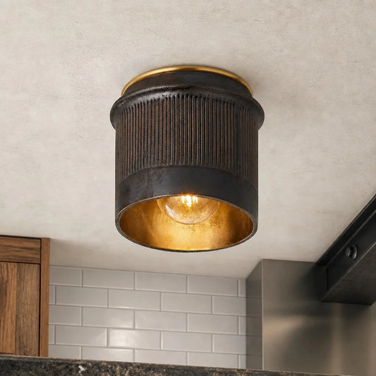 Ceiling light fixture with a textured design on a kitchen ceiling.