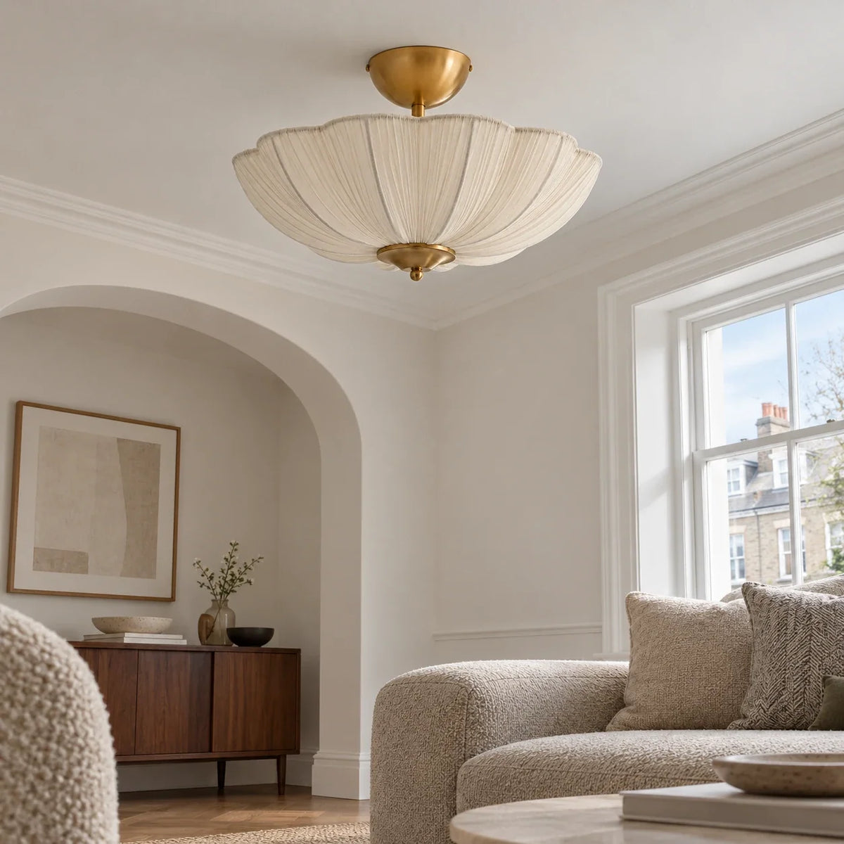 Ivory fabric ceiling light in an arched living room