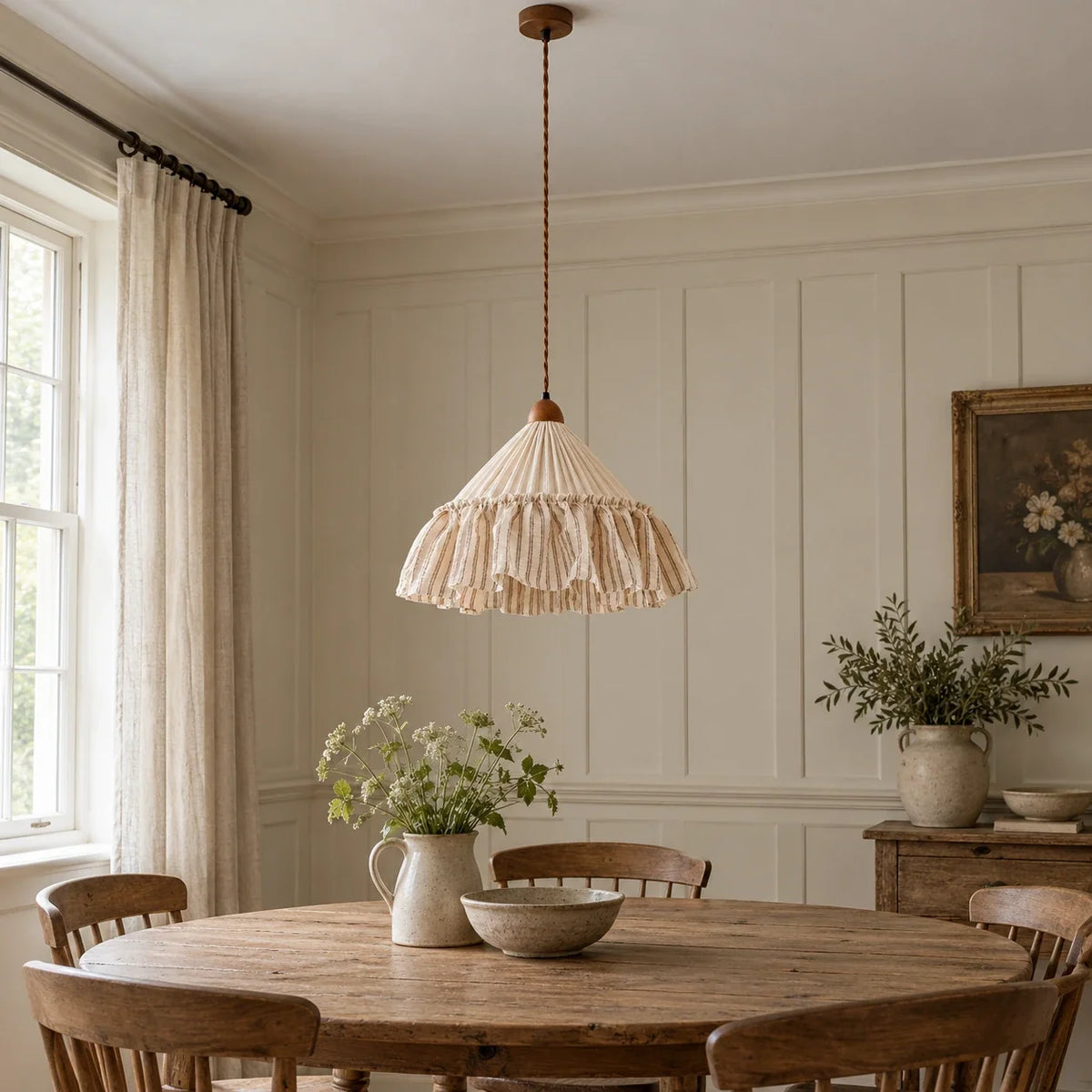 Coffee Stripe Amelie pendant above a round oak dining table