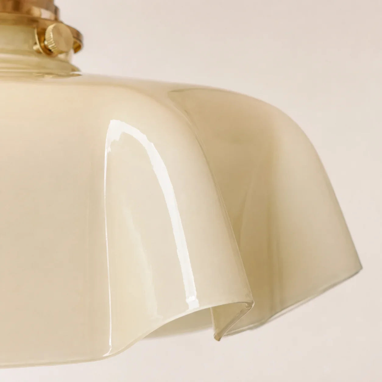 Sharp close-up of the Elowen cream opaline glass shade and scalloped fold