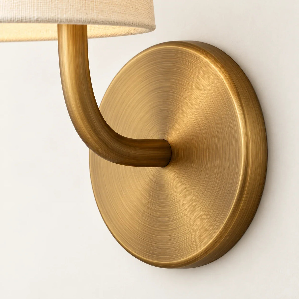 Close view of Hawthorne circular wall plate and curved arm