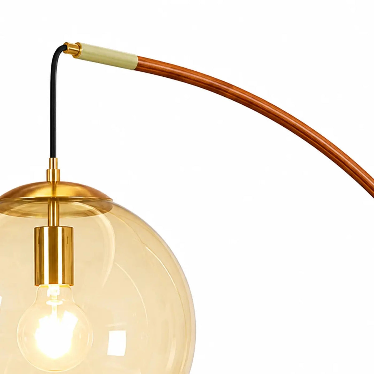 Amber glass globe shade and brass-toned floor lamp fitting