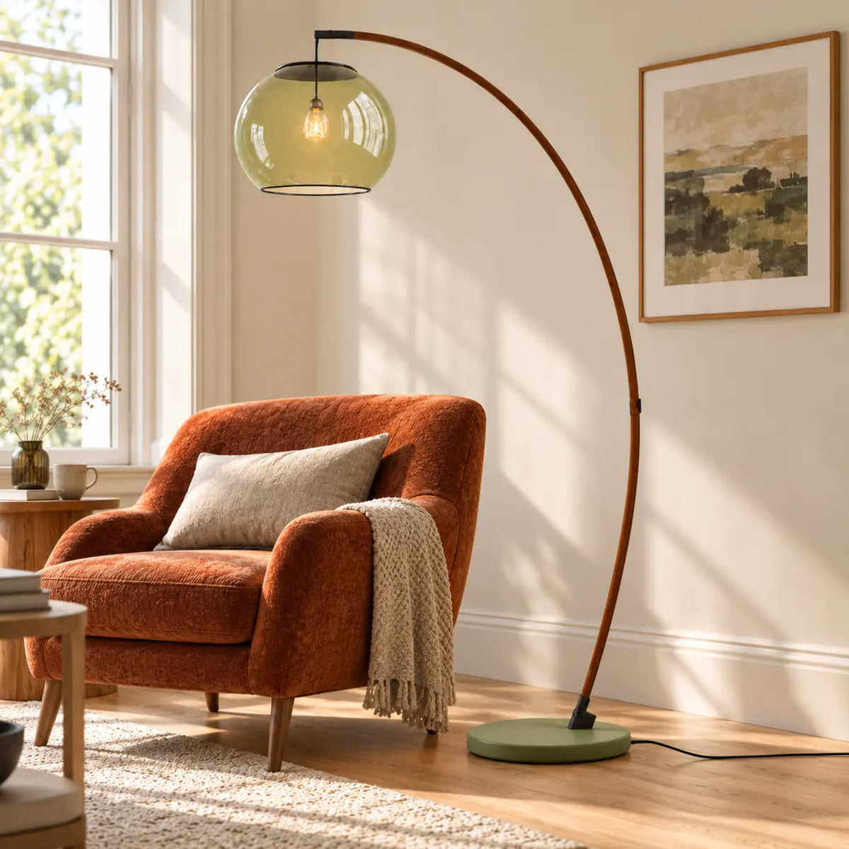 Green glass arc floor lamp beside an accent chair