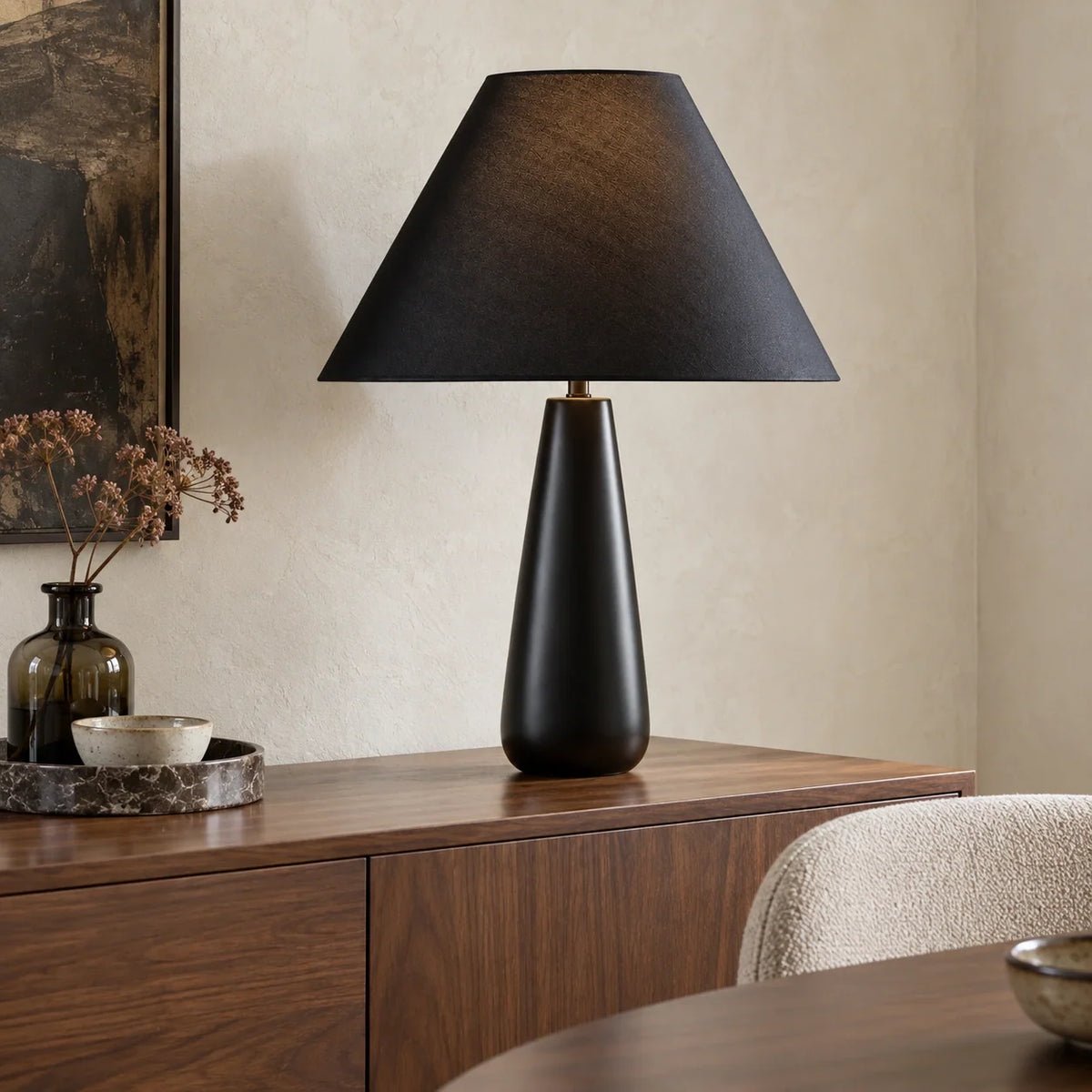 Ceramic black tapered table lamp on a dining room sideboard