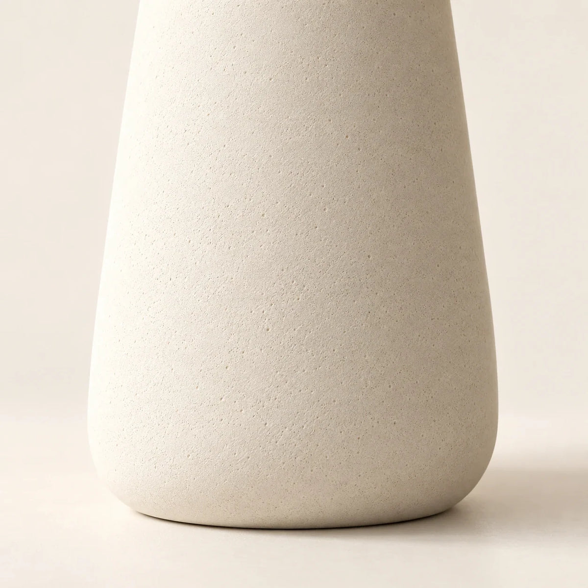 Matte concrete tapered table lamp base texture detail