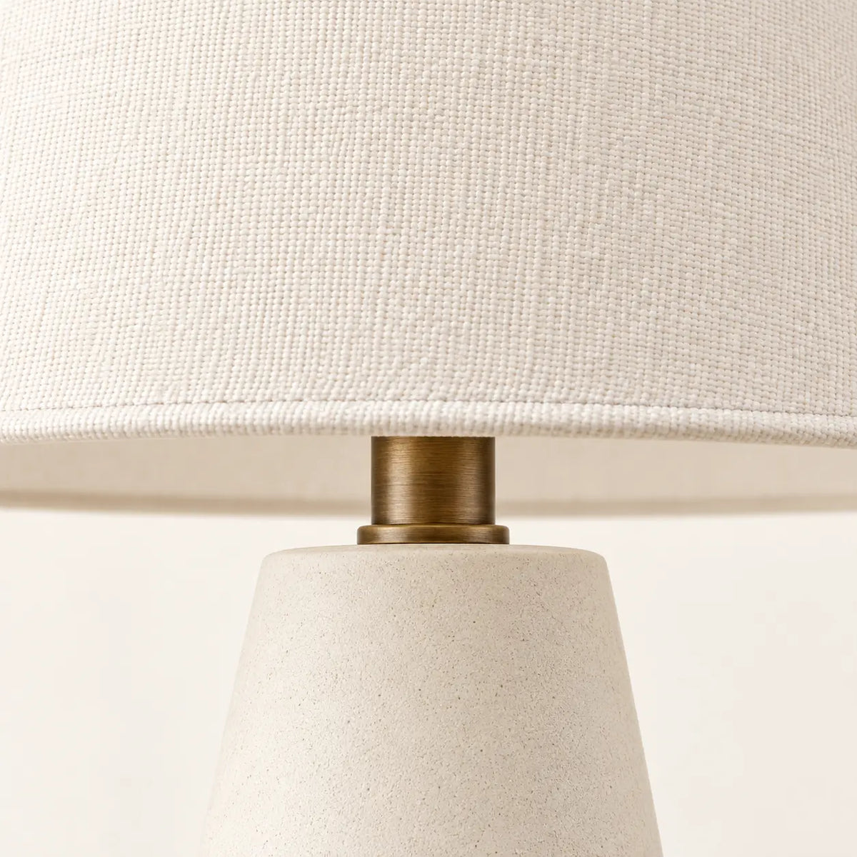 Cream textile lampshade weave and antique brass neck detail