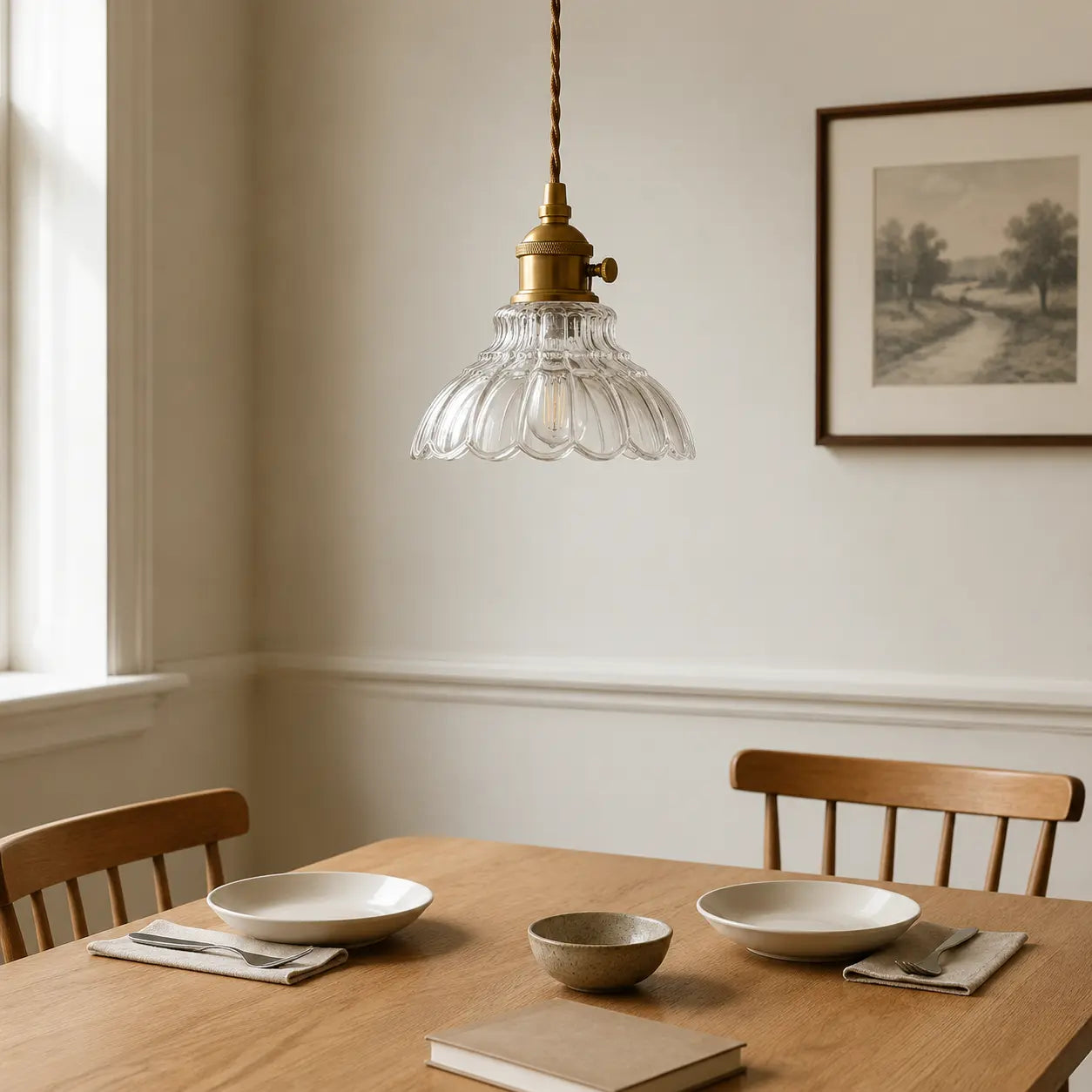 Clear flower glass pendant light above a modern British dining table